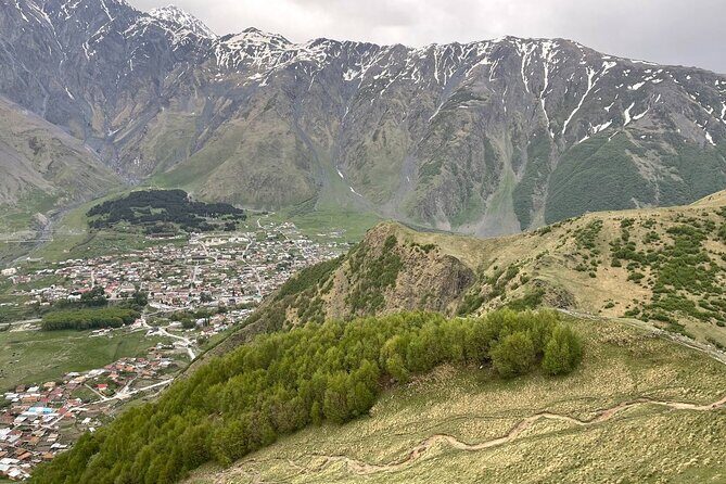 Kazbegi.All inclusive tour in Caucasus mountains - Arch of Friendship and Stepantsminda: Icon Photos with Real Meaning