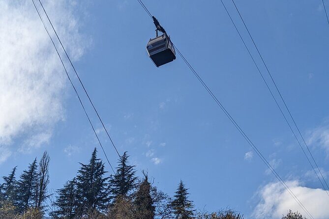 Kutaisi: Chiatura Cable Cars & Katskhi Pillar Guided Tour - Mgvimevi Monastery: Rock-Carved Quiet Time