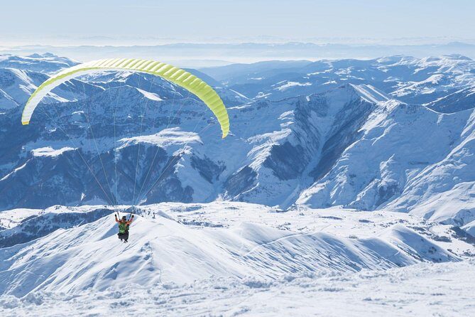 Private Full Day Tour In Kazbegi - Gudauri (Paragliding & Rafting) - Russian-Georgian Friendship Monument: views, mural, and paragliding nearby