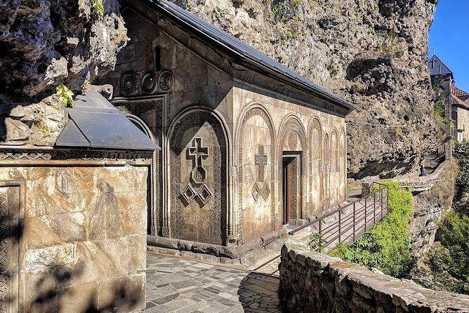 Soviet past - Private day tour to Chiatura, Katskhi pillar and Chronicles - Mgvimevi Monastery: cave walls, late medieval setting, and real steps