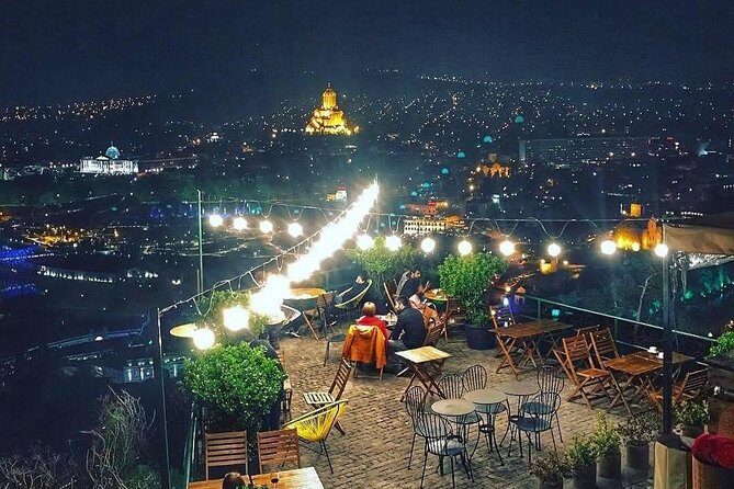 Tbilisi by Night Walking Tour - Rezo Gabriadze Marionette Theater and the clock tower angel moment